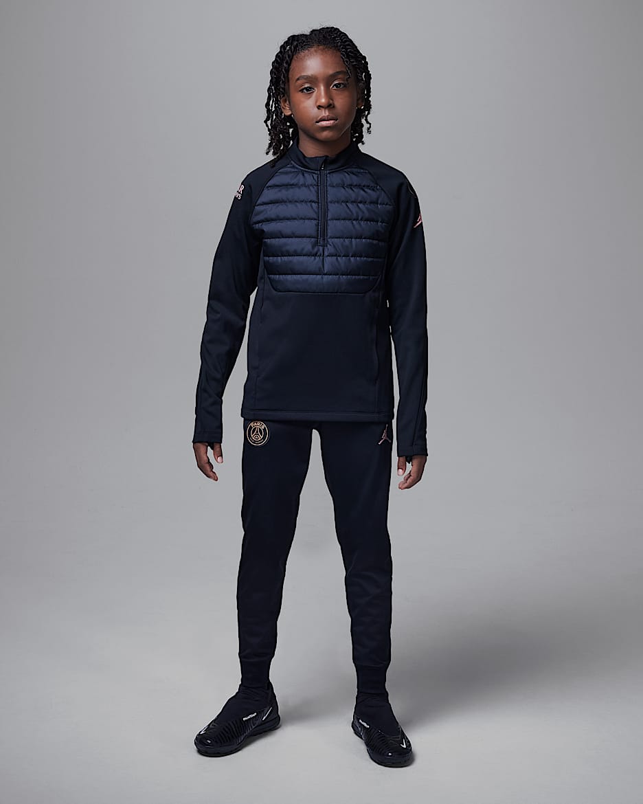 Paris Saint Germain Academy Winter Warrior Older Kids Jordan Therma FIT Football Drill Top. Nike CA